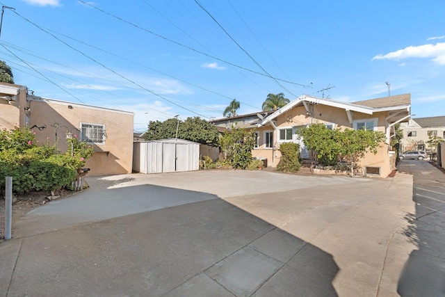 view of patio / terrace with a storage unit