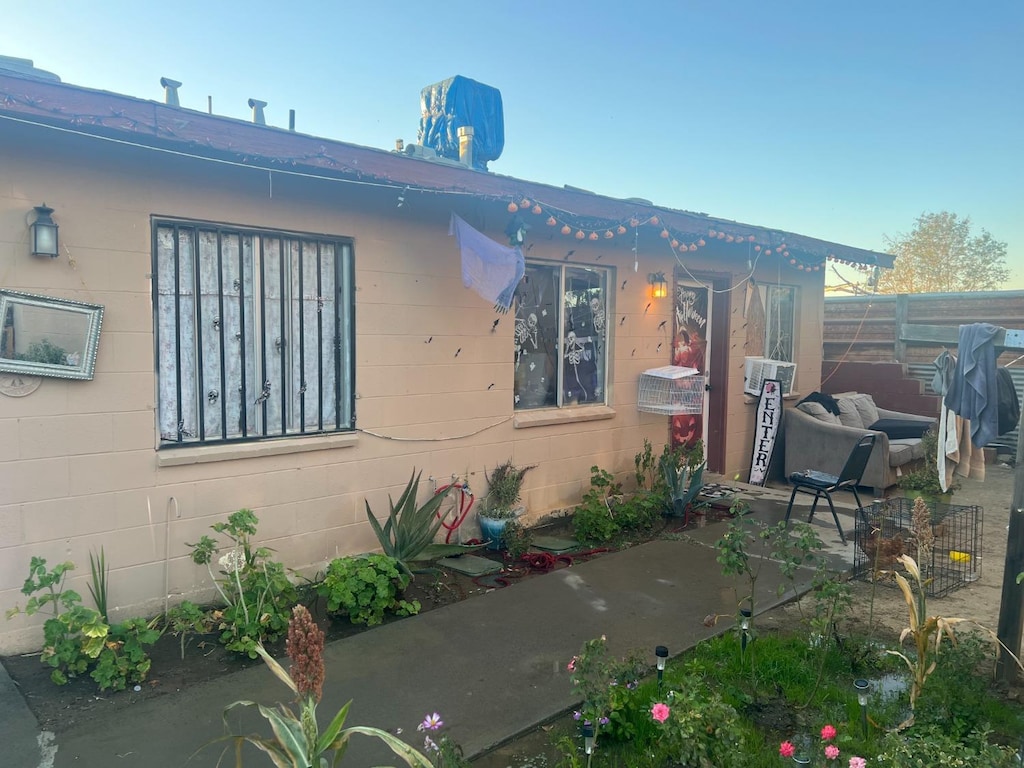 view of home's exterior with a patio area and cooling unit