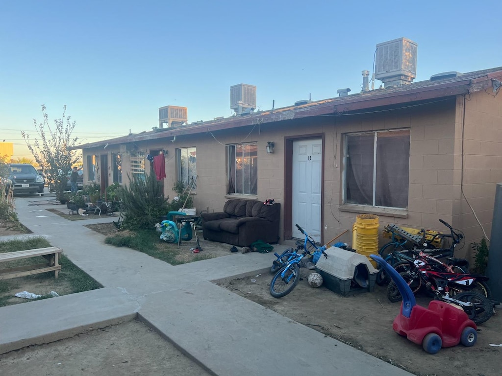 back of property featuring cooling unit