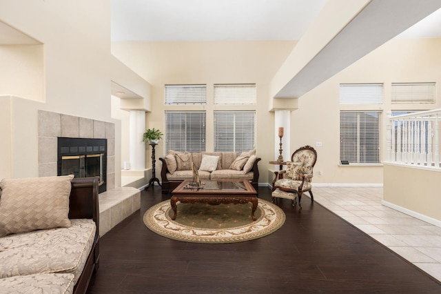 tiled living room with a tile fireplace