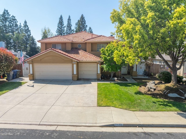 mediterranean / spanish home with a front yard