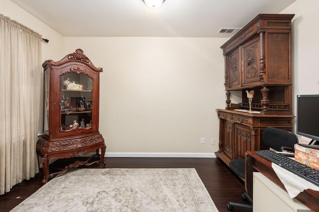 office with dark hardwood / wood-style flooring