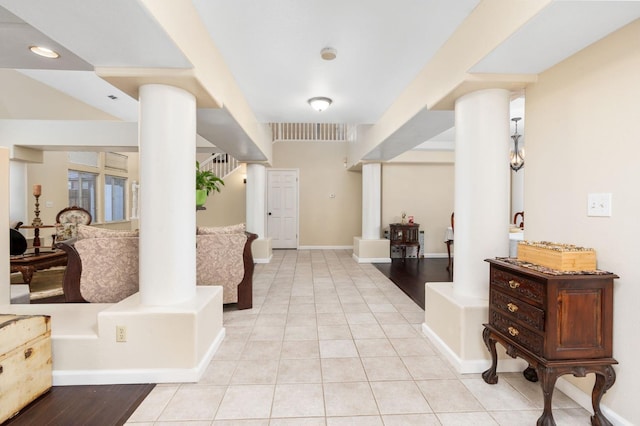 tiled entrance foyer with ornate columns