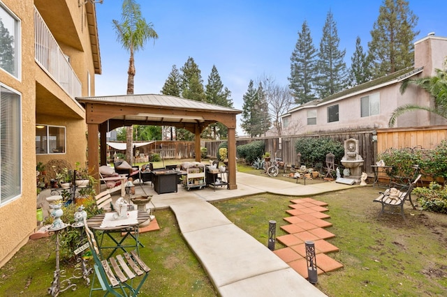 view of yard featuring a gazebo, outdoor lounge area, and a patio area