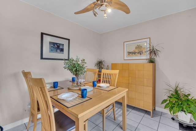 dining space with ceiling fan and light tile patterned floors