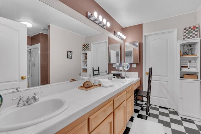 bathroom with a shower with door and vanity