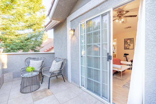 balcony featuring ceiling fan