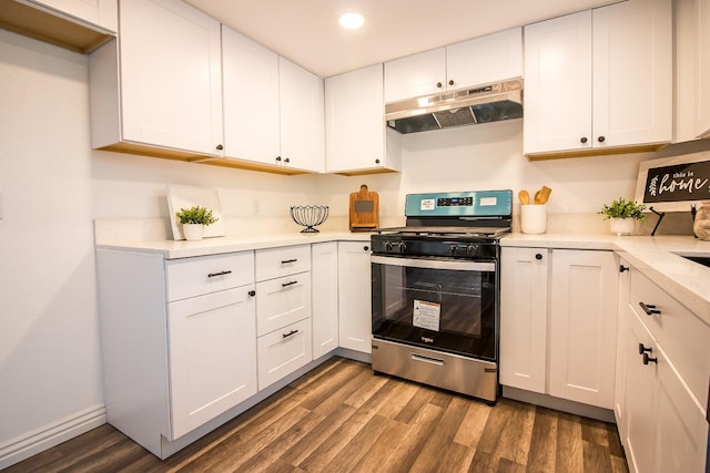 kitchen with white cabinetry, stainless steel range oven, and dark wood-type flooring