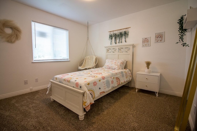 bedroom featuring dark colored carpet