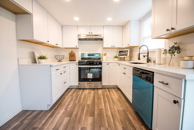 kitchen featuring white cabinetry, stainless steel appliances, hardwood / wood-style floors, and sink