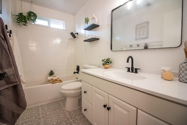 full bathroom with vanity, toilet, and tiled shower / bath