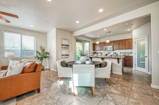 dining area featuring a wealth of natural light and ceiling fan