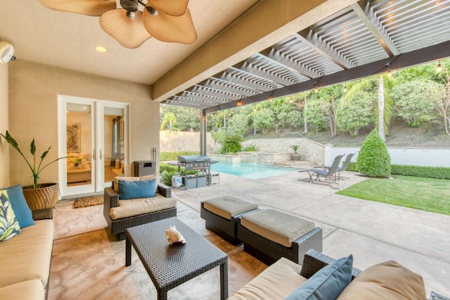 view of patio featuring grilling area, a pergola, ceiling fan, a fenced in pool, and outdoor lounge area