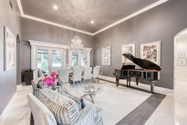 living room featuring a towering ceiling and an inviting chandelier