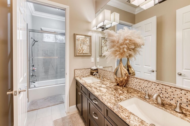 bathroom featuring decorative backsplash, bath / shower combo with glass door, ornamental molding, vanity, and tile patterned floors