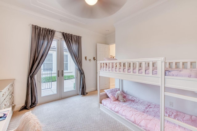 carpeted bedroom with access to outside, ornamental molding, and ceiling fan