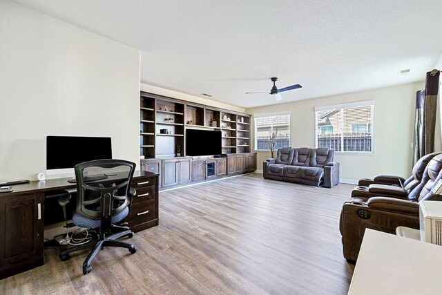 3313 Whiteash Ave, Clovis, CA 93619 - living room with wood finished floors, a ceiling fan, an office area, and baseboards