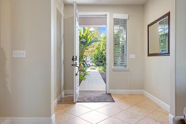 entrance foyer featuring light tile patterned flooring