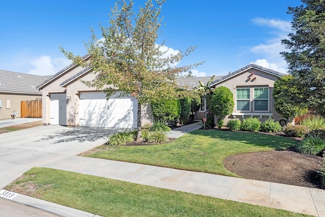 view of front of home with a garage and a front lawn