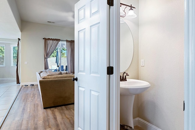 bathroom featuring wood-type flooring