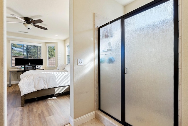 bedroom featuring wood-type flooring and ceiling fan