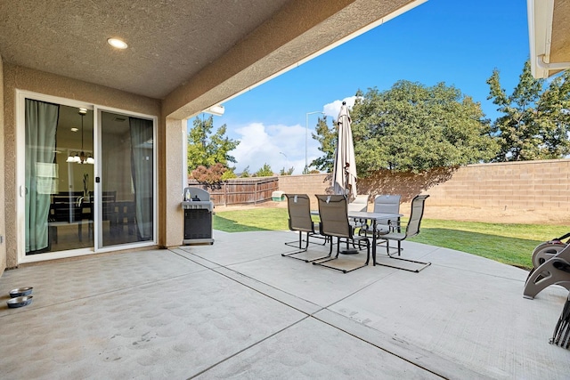 3313 Whiteash Ave, Clovis, CA 93619 - view of patio with outdoor dining space and a grill