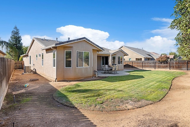 back of house featuring a patio, cooling unit, and a yard