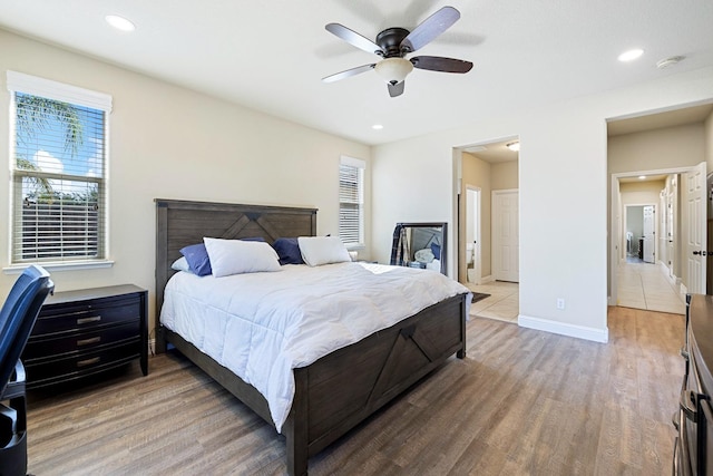 bedroom featuring hardwood / wood-style floors and ceiling fan