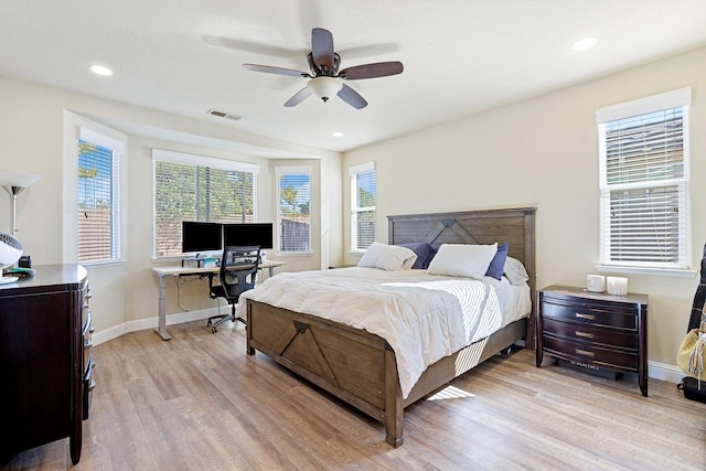 bedroom featuring light wood-type flooring and ceiling fan