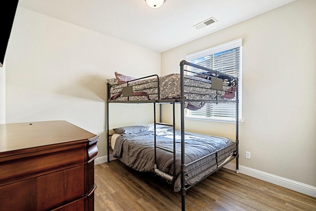 bedroom with wood-type flooring