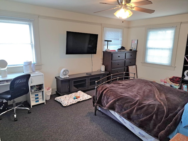 bedroom featuring ceiling fan and carpet