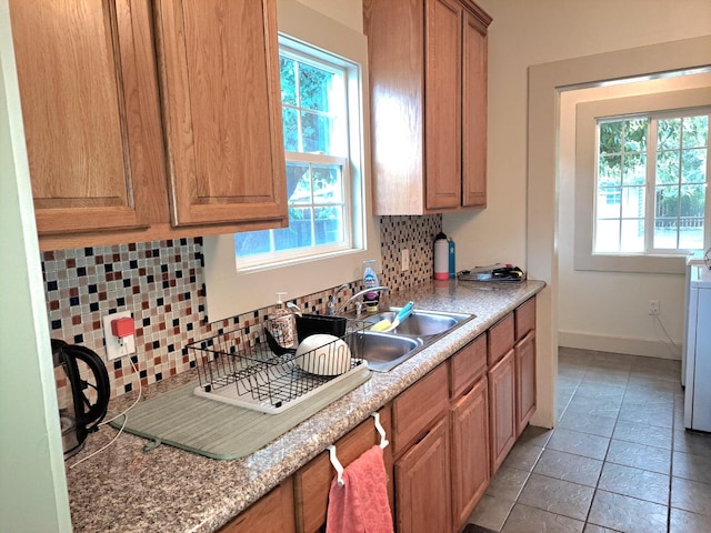 kitchen with sink and tasteful backsplash