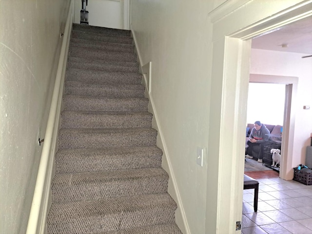 stairs with tile patterned flooring