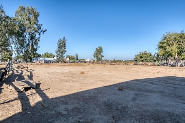 view of yard with a rural view