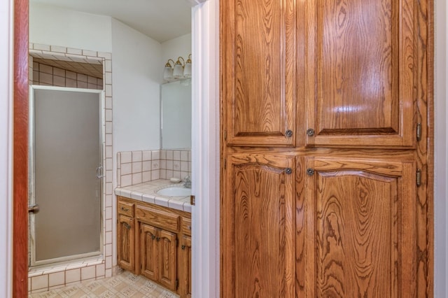 bathroom with vanity and walk in shower