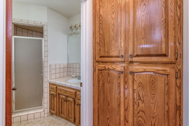 3080 N Grantland Ave, Fresno, CA 93723 - bathroom featuring vanity, a shower stall, decorative backsplash, and tile patterned floors