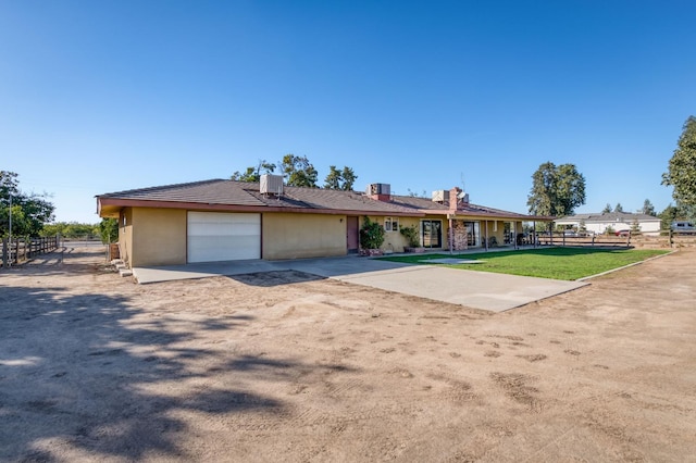 3080 N Grantland Ave, Fresno, CA 93723 - single story home featuring dirt driveway, a garage, stucco siding, and a chimney