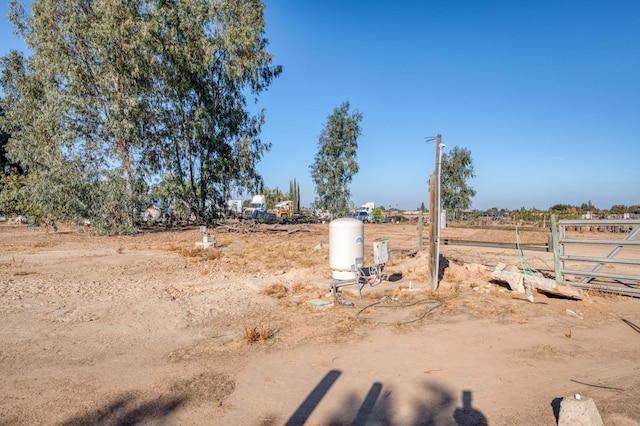 view of yard with a rural view