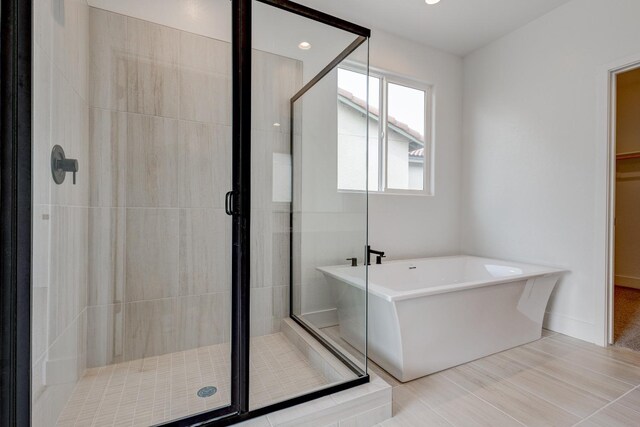 bathroom with independent shower and bath