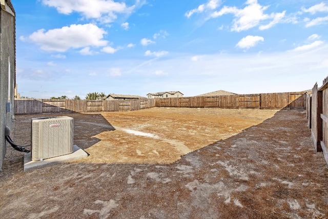 view of yard with central AC unit