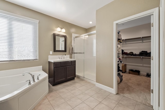 bathroom with vanity, independent shower and bath, and tile patterned floors