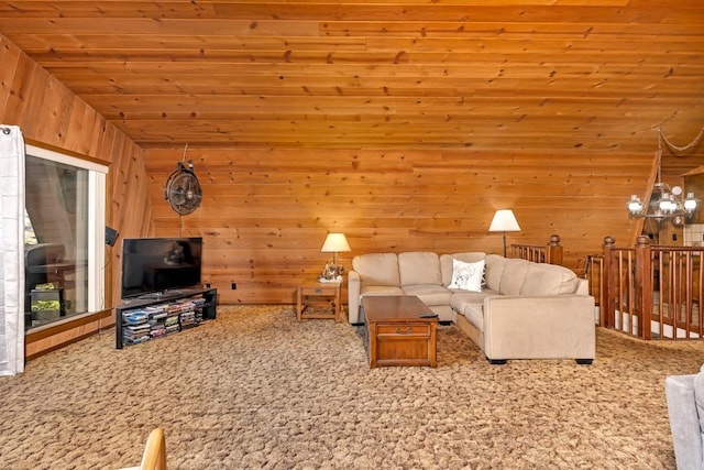 living room featuring light carpet, wood ceiling, an inviting chandelier, and wood walls