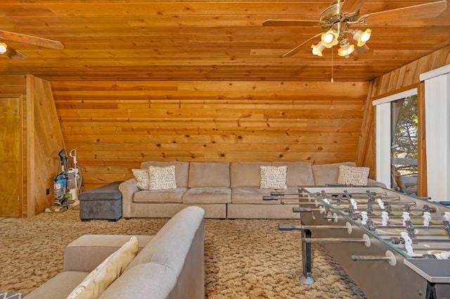 living room featuring wood walls, wood ceiling, carpet floors, and ceiling fan