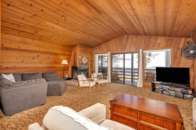 carpeted living room with wood ceiling, wood walls, and vaulted ceiling