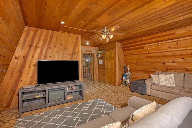 living room with wood ceiling, wooden walls, and ceiling fan