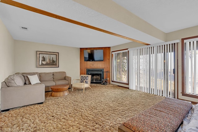 living room with carpet flooring and a fireplace