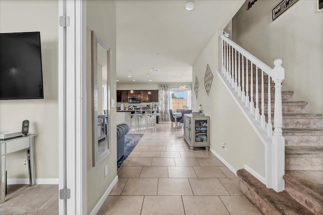 foyer entrance with light tile patterned floors