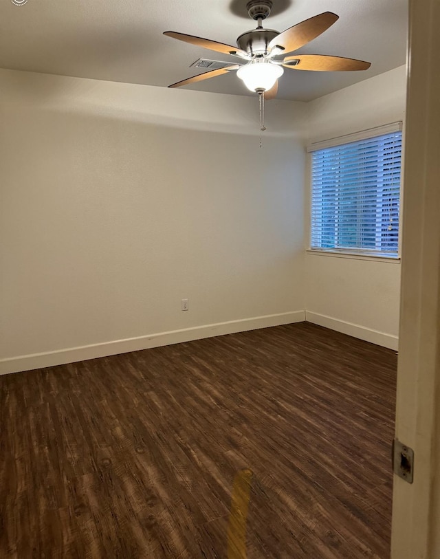 unfurnished room featuring ceiling fan and dark hardwood / wood-style floors