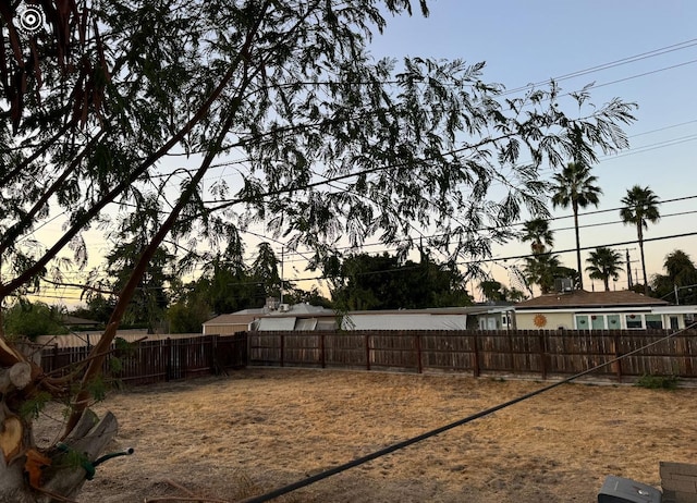 view of yard at dusk