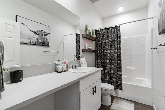 full bathroom featuring wood-type flooring, vanity, toilet, and shower / bath combo with shower curtain